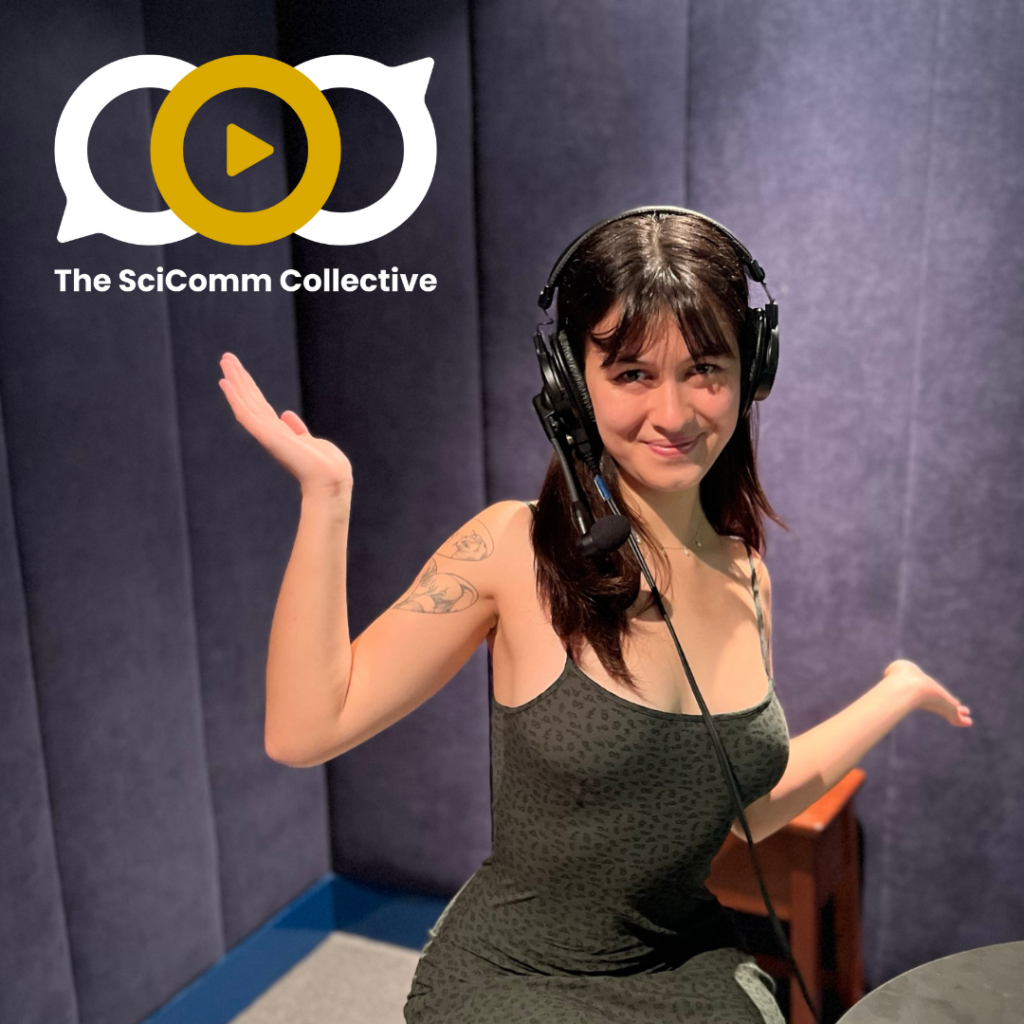 A young white woman with brown hair wearing headphones in a room with padded purple-grey walls, her arms outsretched and upturned.
